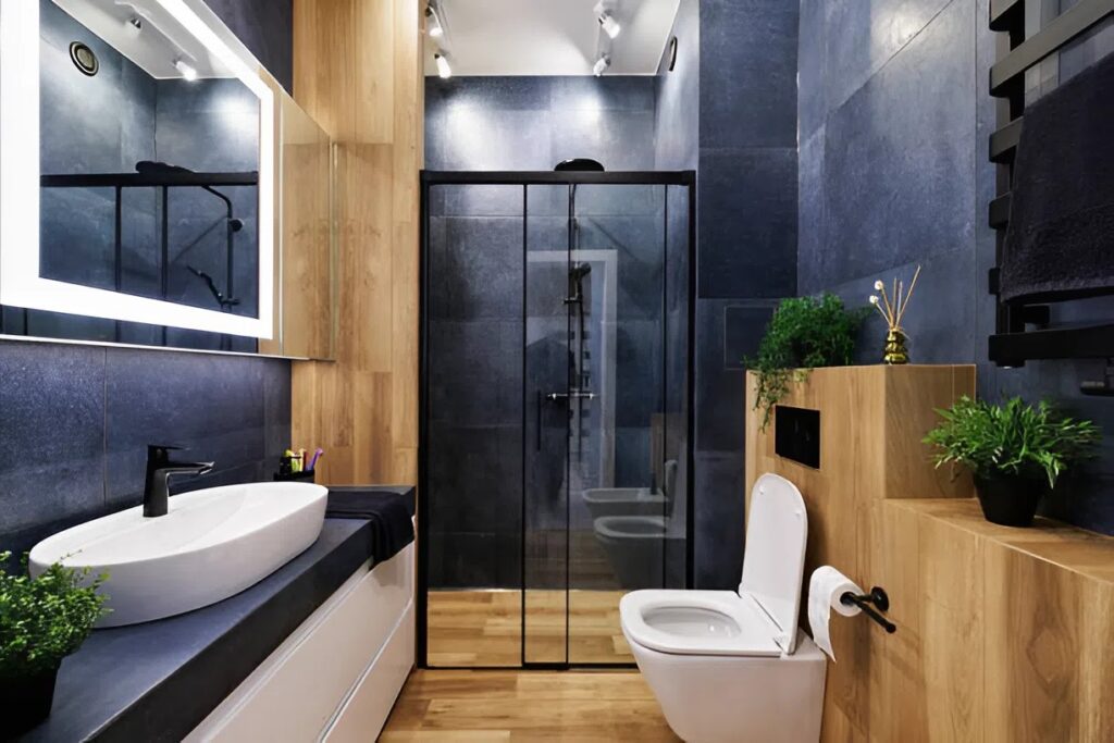 Bold bathroom design with deep blue painted walls and wood accents completed by a skilled house painter in Ames, IA