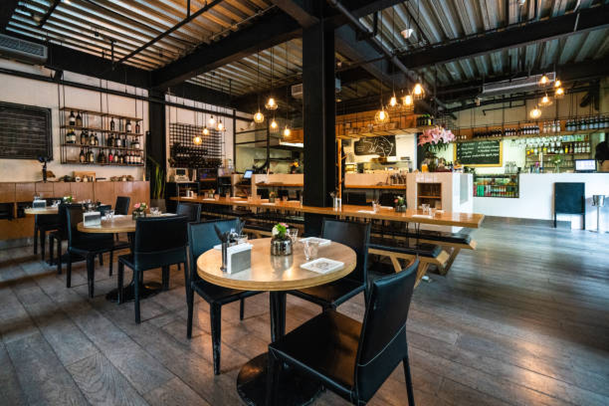 Restaurant interior with warm neutral wall colors and coordinated finishes enhancing ambiance by a painter in Altoona, IA